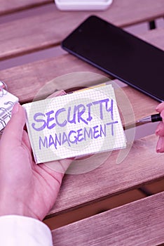 Hand writing sign Security Management. Business overview is the identification of an organization s is assets
