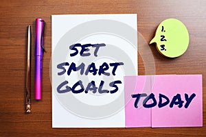 Hand writing sign Set Smart Goals. Business idea Establish achievable objectives Make good business plans