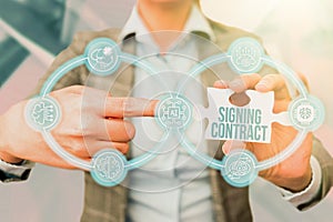 Hand writing sign Signing Contract. Business approach the parties signing the document agree to the terms Business Woman