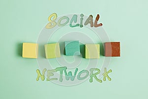 Hand writing sign Social Network. Word for a framework of individual linked by interan individualal relationship Stack photo