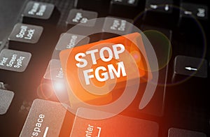 Hand writing sign Stop Fgm. Conceptual photo Put an end on female genital cutting and female circumcision