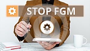 Hand writing sign Stop Fgm. Internet Concept Put an end on female genital cutting and female circumcision