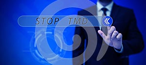 Hand writing sign Stop Tmd. Business showcase Prevent the disorder or problem affecting the chewing muscles photo