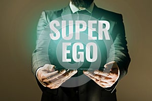 Hand writing sign Super Ego. Business concept The I or self of any person that is empowering his whole soul