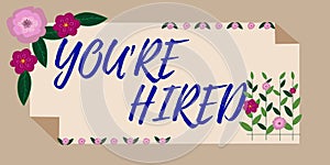 Hand writing sign You Re Hired. Concept meaning New Job Employed Newbie Enlisted Accepted Recruited Frame Decorated With