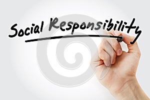 Hand writing Social responsibility with marker