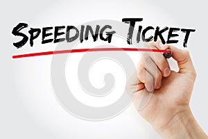 Hand writing Speeding ticket with marker