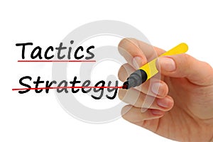 Hand writing Strategy and Tactics with red marker on transparent