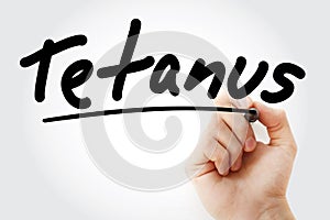 Hand writing Tetanus with marker