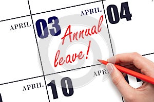 Hand writing the text ANNUAL LEAVE and drawing the sun on the calendar date April 3