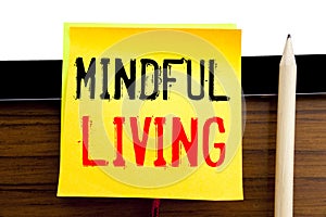 Hand writing text caption inspiration Mindful Living. Business concept for Life Happy Awareness written on sticky note paper on