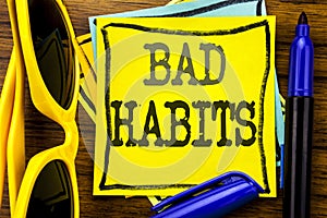 Hand writing text caption inspiration showing Bad Habits. Business concept for Improvement Break Habitual Hebit Written on sticky