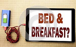 Hand writing text caption inspiration showing Bed Breakfast. Business concept for Holiday Journey Travel written on tablet laptop