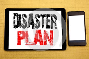 Hand writing text caption inspiration showing Disaster Plan. Business concept for Emergency Recovery Written on tablet laptop, woo