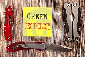 Hand writing text caption inspiration showing Green Technology. Business concept for campaign, Written on sticky note wooden backg