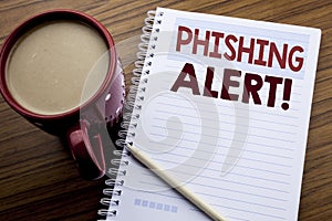 Hand writing text caption inspiration showing Phishing Alert. Business concept for Fraud Warning Danger written on note paper note