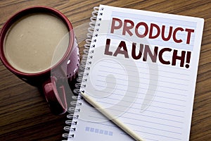 Hand writing text caption inspiration showing Product Launch. Business concept for New Products Start written on note paper notepa