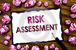 Hand writing text caption inspiration showing Risk Assessment. Business concept for Safety Danger Analyze Written on sticky note p