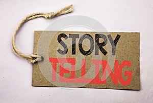 Hand writing text caption inspiration showing Storytelling. Business concept for Teller Story Message written on price tag paper o