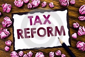 Hand writing text caption inspiration showing Tax Reform. Business concept for Government Change in Taxes Written on sticky note p