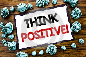 Hand writing text caption inspiration showing Think Positive. Business concept for Positivity Attitude Written on sticky note pape