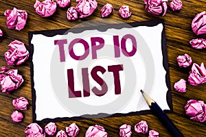 Hand writing text caption inspiration showing Top 10 Ten List. Business concept for Success ten list Written on sticky note paper,