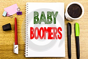 Hand writing text caption showing Baby Boomers. Business concept for Demographic Generation Written on notepad note paper backgrou