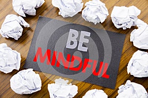 Hand writing text caption showing Be Mindful. Business concept for Mindfulness Healthy Spirit written on sticky note paper on the