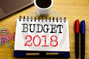 Hand writing text caption showing Budget 2018. Business concept for Household budgeting accounting planning written on notebook bo