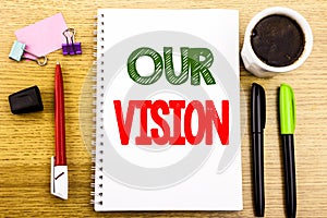 Hand writing text caption showing Our Vision. Business concept for Marketing Strategy Vision Written on notepad note paper backgro