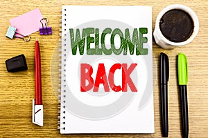 Hand writing text caption showing Welcome Back. Business concept for Emotion Greeting Written on notepad note paper background wit