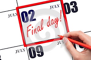 Hand writing text FINAL DAY on calendar date July 2.  A reminder of the last day. Deadline. Business concept.
