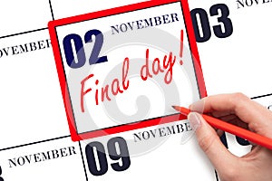 Hand writing text FINAL DAY on calendar date November 2. A reminder of the last day. Deadline. Business concept.