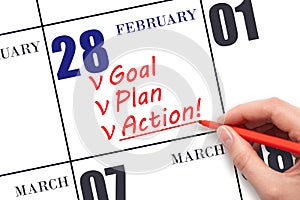 Hand writing text GOAL PLAN ACTION on calendar date February 28. Motivation for a new day. Business concept.