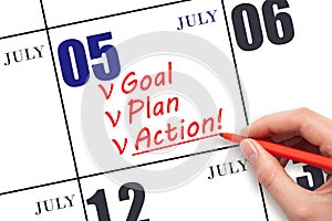 Hand writing text GOAL PLAN ACTION on calendar date July 5. Motivation for a new day. Business concept.