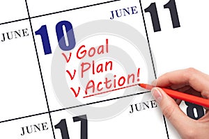 Hand writing text GOAL PLAN ACTION on calendar date June 10. Motivation for a new day. Business concept.