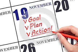 Hand writing text GOAL PLAN ACTION on calendar date November 19. Motivation for a new day. Business concept.