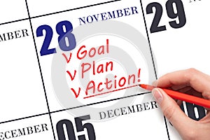 Hand writing text GOAL PLAN ACTION on calendar date November 28. Motivation for a new day. Business concept.