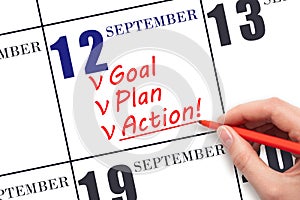 Hand writing text GOAL PLAN ACTION on calendar date September 12. Motivation for a new day. Business concept.