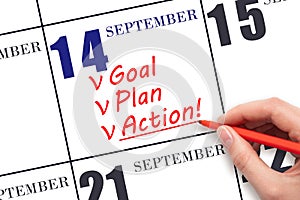 Hand writing text GOAL PLAN ACTION on calendar date September 14. Motivation for a new day. Business concept.