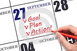 Hand writing text GOAL PLAN ACTION on calendar date September 27. Motivation for a new day. Business concept.