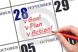 Hand writing text GOAL PLAN ACTION on calendar date September 28. Motivation for a new day. Business concept.