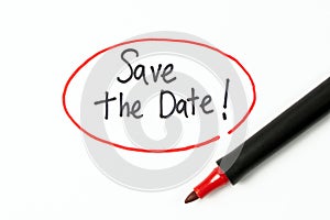 Hand writing text save the date with red marker pen