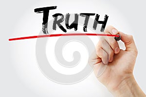 Hand writing Truth with marker