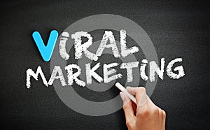 Hand writing Viral Marketing on blackboard, business concept