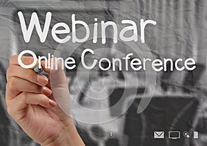 Hand writing Webinar with crumpled paper background
