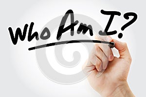 Hand writing Who Am I? with marker