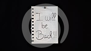 Hand written message on a ripped notebook sheet  