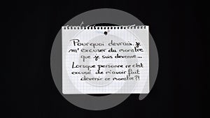 Hand written message on a ripped notebook sheet: Why should i apologize for the monster i have become, when no one apologize for m