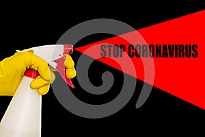 Hand in a yellow glove with a disinfectant on a black background. Poster with text stop coronavirus